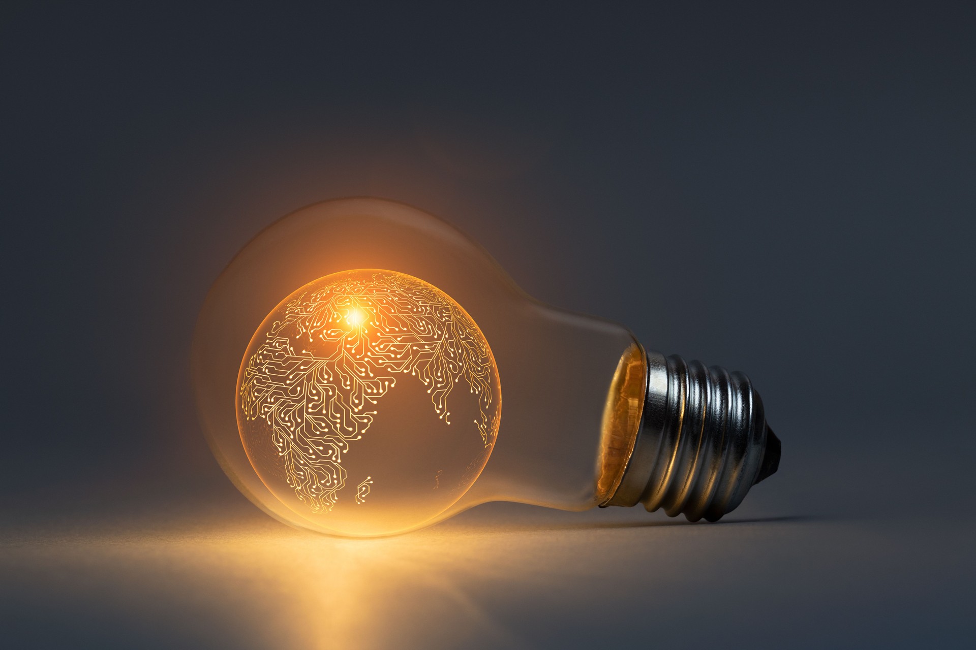 Artificial intelligence planet earth concept with classic light bulb glowing in the dark
